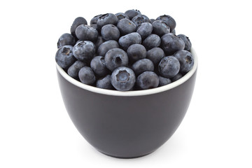 Fresh ripe organic blueberries in a black bowl on a white background

