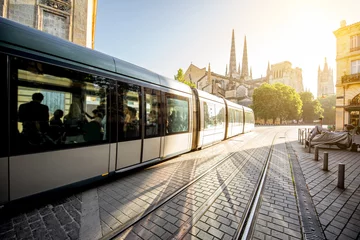 Fotobehang Morning street view with tram and saint Pierre cathedral in Bordeaux city, France © rh2010
