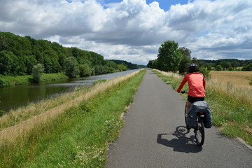 Biker riding on a bicycle path alongside the Morava River in the Czech Republic. Moravian bicycle path .