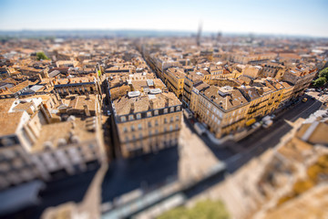 Aerial cityscape view on the old town of Bordeaux city during the sunny day in France. Tilt-shift...