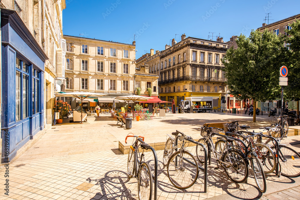 Wall mural view on the small square with bicycles in bordeaux city in france