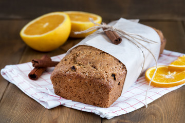 Christmas spicy cake with orange and cinnamon Holiday background Winter Fruit cake