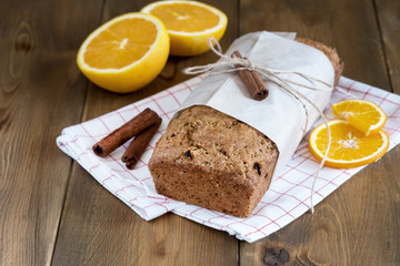 Christmas spicy cake with orange and cinnamon Holiday background Winter Fruit cake