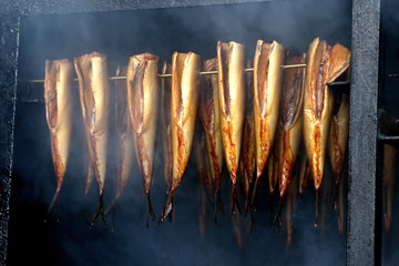 Fresh smoked fish in smoker grill