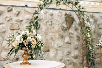 decorated wedding area with flowers on wooden background