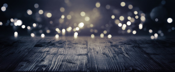 Gold and silver bokeh on a dark background