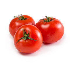 Three ripe red tomatoes isolated on white background