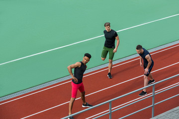 Young multiethnic athlete group make stretching exercises