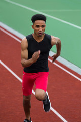 Obraz premium African athlete man run on running track outdoors