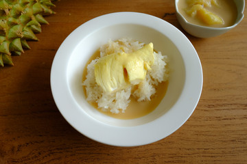 Sticky rice toping with durian in the coconut milk