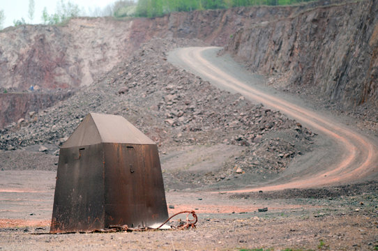 dirty road leadning through a quarry mine