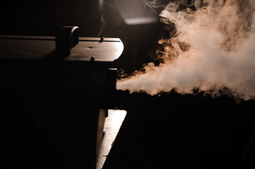lights in smoke, studio lights shining through the smoke from smoke machine.