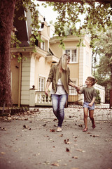 Mother running with her daughter.