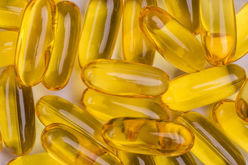 Yellow soft gelatin capsules common use in pharmaceutical manufacturing industry, extract natural...