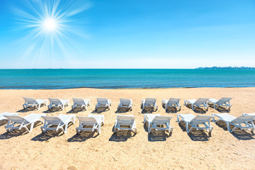 Fototapeta na wymiar Beach chairs on the beach