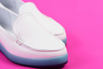 Low heel footwear in sports style. Moccasins for women