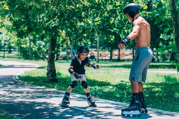 Grandfather and grandson spending quality time, roller skating