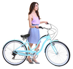 Fototapeta na wymiar Beautiful young woman with bicycle on white background