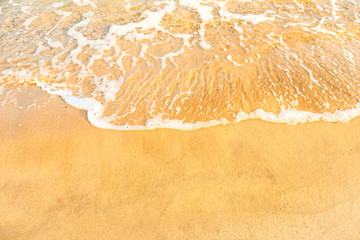 Beach sand and ocean wave