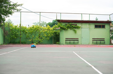 Empty tennis court in the summer.