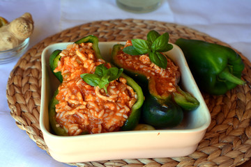Stuffed green bell peppers with ground beef on a bowl