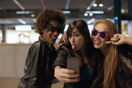 Three Cool Girl Firends Taking Selfie On Night Out Celebrating