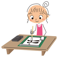 習字をする女の子