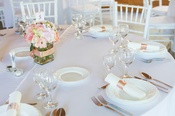 table setting with spoon, knife, plates and glass