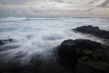 Misty Water Over Lava Rocks