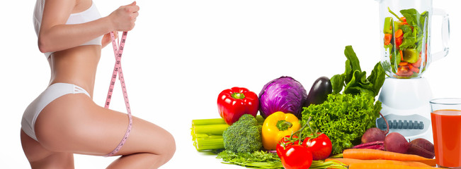 Woman measuring her body with a measure tape. Diet concept, fresh vegetables
