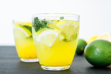 Cold and refreshing citrus cocktail with lemon and limes