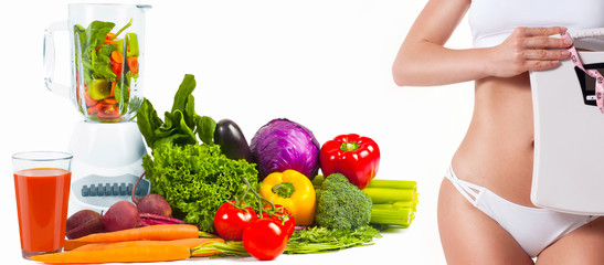 Diet concept, fresh vegetables. Woman with weight scale.
