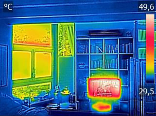 Infrared thermovision image showing heated TV and a window in the living room