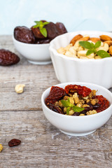 Different types of nuts and dried fruits.  Healthy dietary snack, dried fruit, nuts, top view.