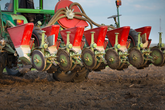 Seeder for sowing attached to tractor on soil