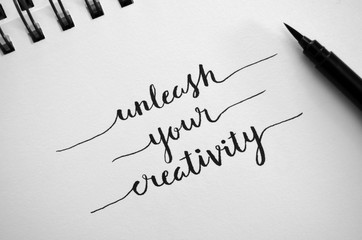 UNLEASH YOUR CREATIVITY inspirational quote in hand-drawn lettering © HowLettery Studio