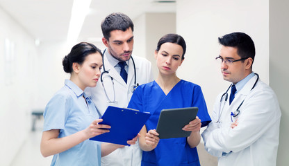 group of medics with clipboards at hospital