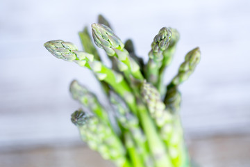 Fresh green asparagus on white