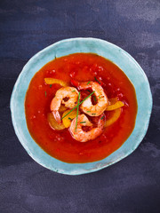 Shrimp Gazpacho with Red and Yellow Bell Pepper. Spanish soup. Vegetable puree with prawns. View from above, top studio shot
