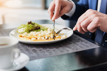 Businessman having breakfast in restaurant