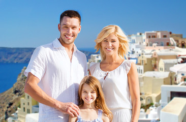 Fototapeta na wymiar happy family over santorini island background