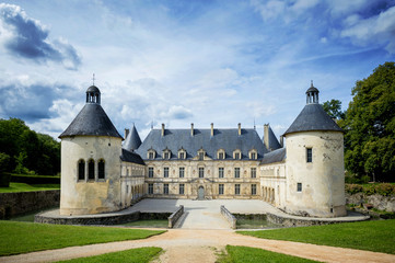 Fototapeta na wymiar The castle of Bussy-Rabutin makes cohabit several epochs. Its façade dates from the 17th century, the ground floor of Louis XIII and the floors of 1649. Burgundy, France. 