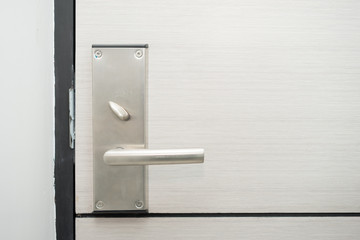 Stainless steel door handle in hotel