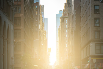 Sunlight shines down the crowded streets of New York City