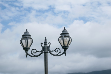 Fototapeta na wymiar Street lamp on cloud and sky background