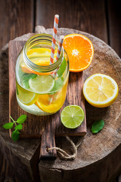 Closeup of water with citrus fruits and mint leaves