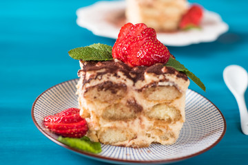 Strawberry tiramisu with mascarpone. Blue background
