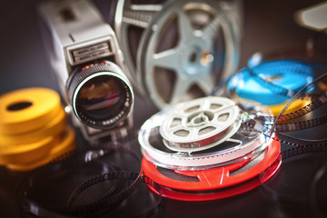 Fototapeta premium 8mm film reels and old camera, selective focus. movie, cinema, entertainment