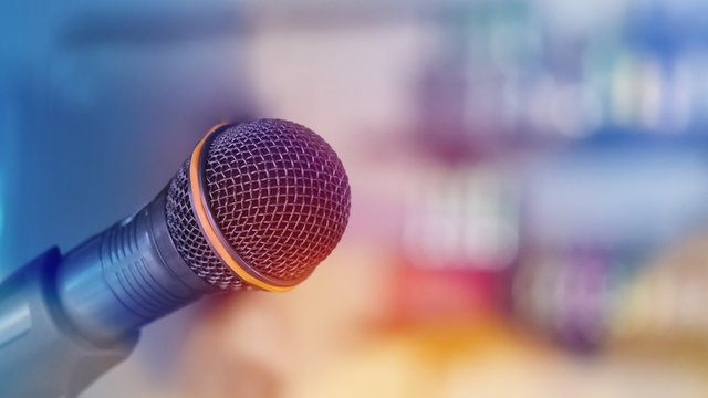 Closeup microphone in meeting room or conference room with blurred light background for business and education concepts