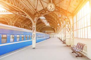 Vintage retro platform passenger railway station. Concept of meeting, waiting, seeing people on the...
